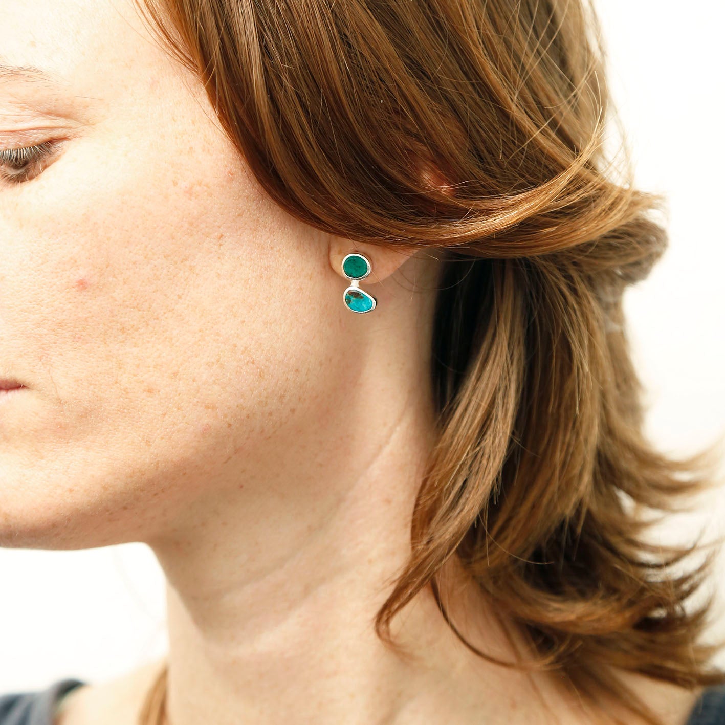 woman wearing beautiful green Chrysoprase and blue green Chrysocolla earrings handmade gemstone jewellery